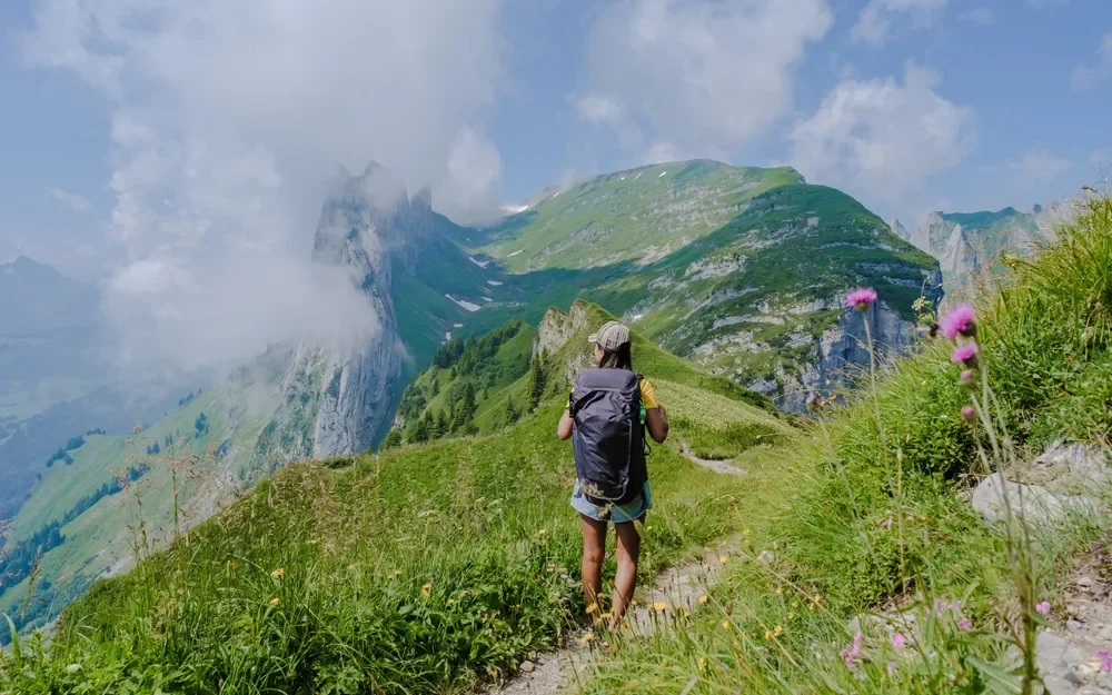 asian,women,hiking,in,the,swiss,alps,mountains,during,summer