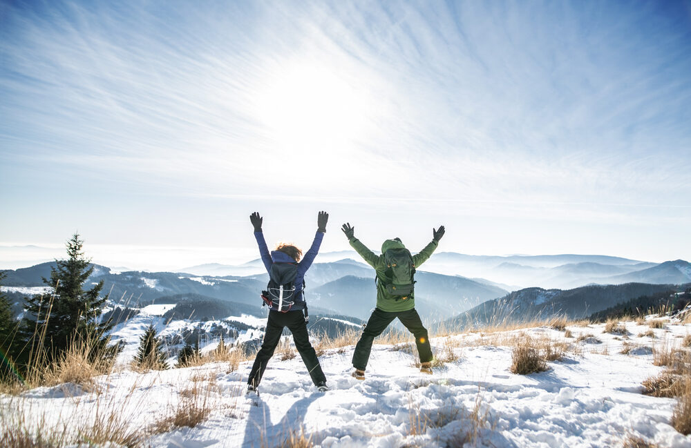 rear,view,of,senior,couple,hikers,in,snow covered,winter,nature, rear,view,of,senior,couple,hikers,in,snow covered,winter,nature,