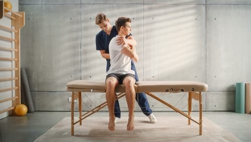 professional,sport,physiotherapist,working,on,specific,muscle,groups,and,back professional,sport,physiotherapist,working,on,specific,muscle,groups,and,back