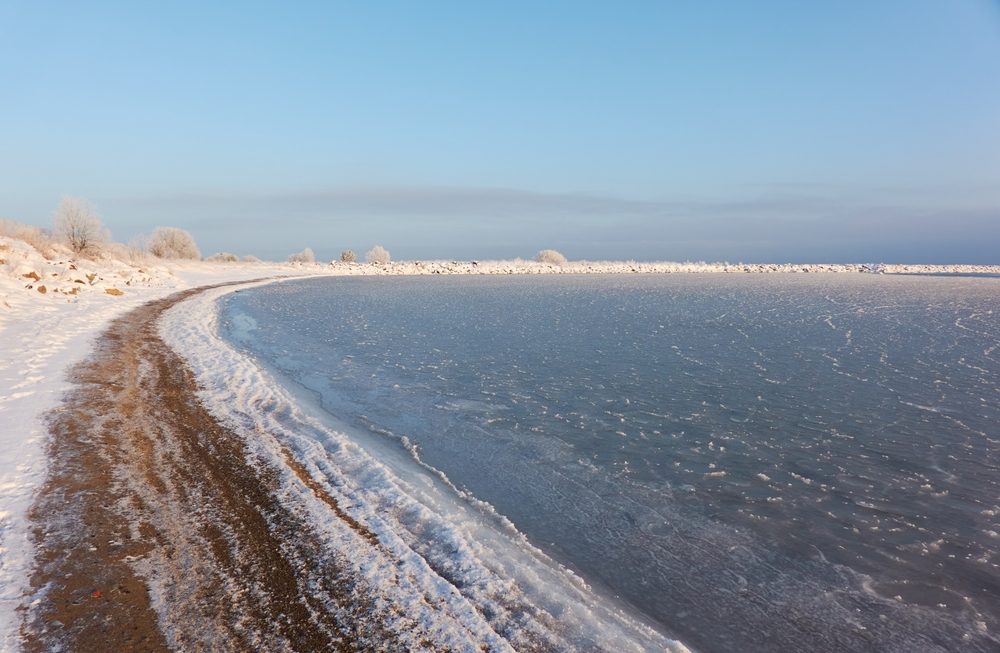 a,view,from,the,frozen,snow covered,baltic,sea,shore.,cloudy a,view,from,the,frozen,snow covered,baltic,sea,shore.,cloudy