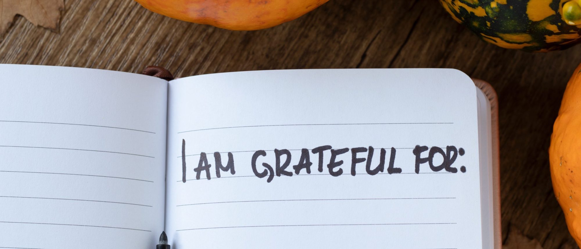 i,am,grateful,for,,handwriting,in,notebook,with,pumpkin,and