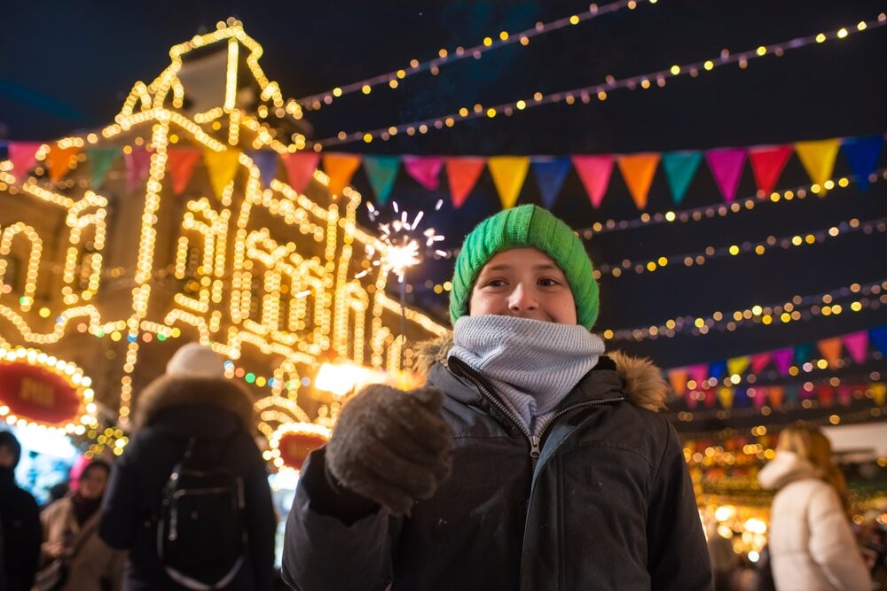 happy,boy,in,winter,clothes,holding,a,burning,sparkler,,having happy,boy,in,winter,clothes,holding,a,burning,sparkler,,having