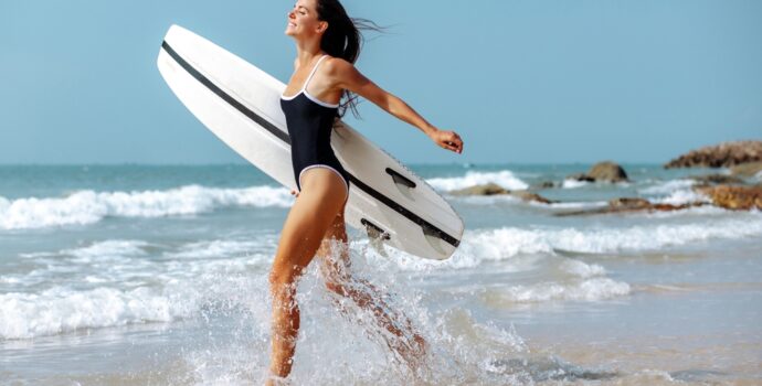 a,young,brunette,woman,in,a,sports,swimsuit,walks,along a,young,brunette,woman,in,a,sports,swimsuit,walks,along