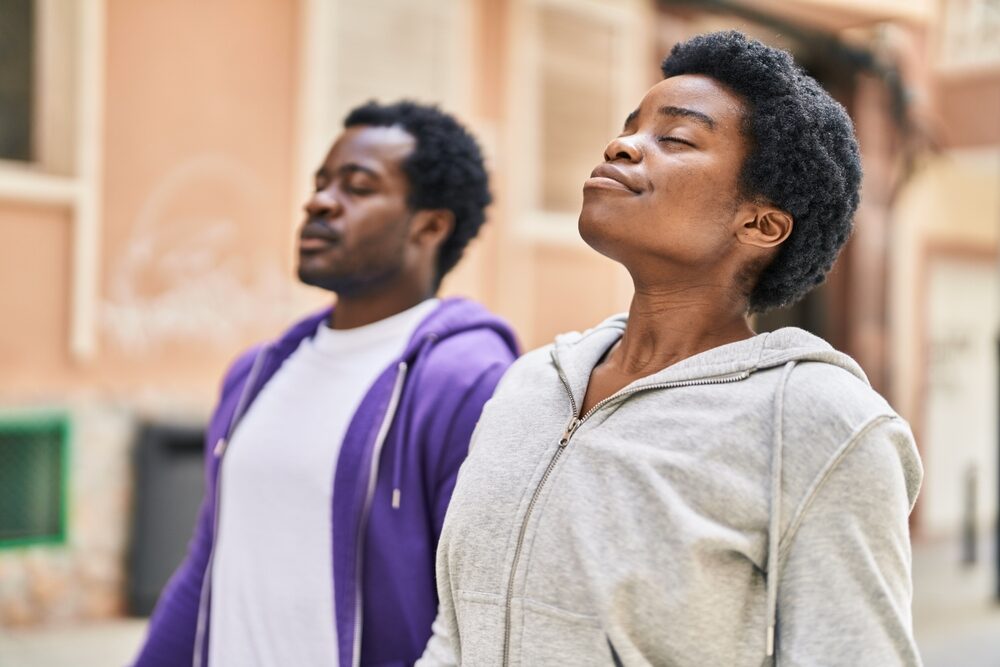african,american,man,and,woman,couple,breathing,at,street