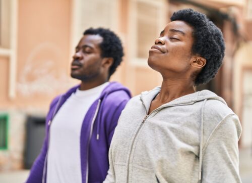 african,american,man,and,woman,couple,breathing,at,street