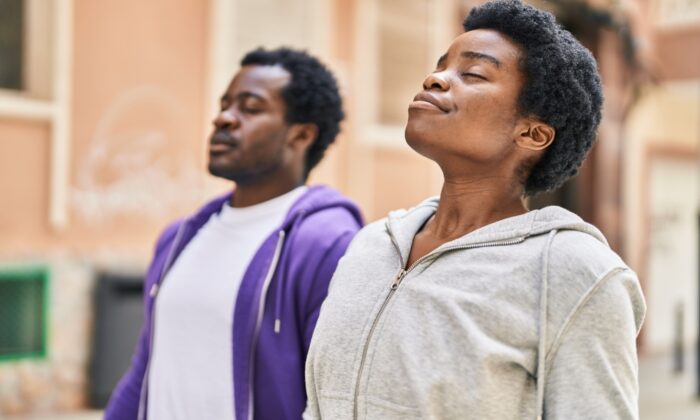 african,american,man,and,woman,couple,breathing,at,street