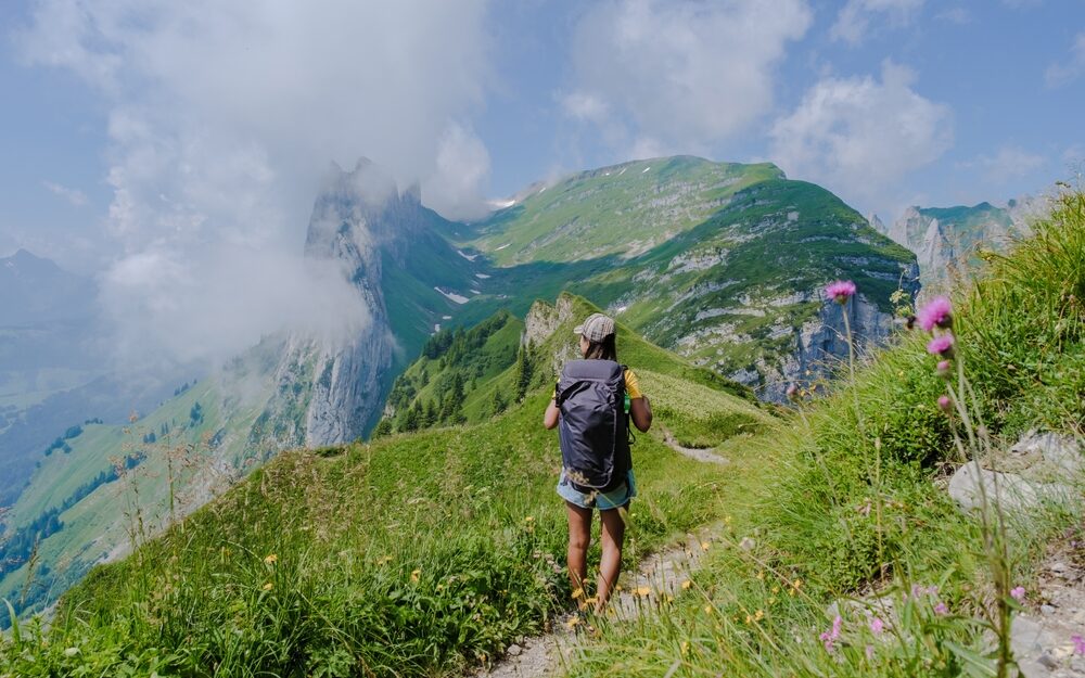 asian,women,hiking,in,the,swiss,alps,mountains,during,summer