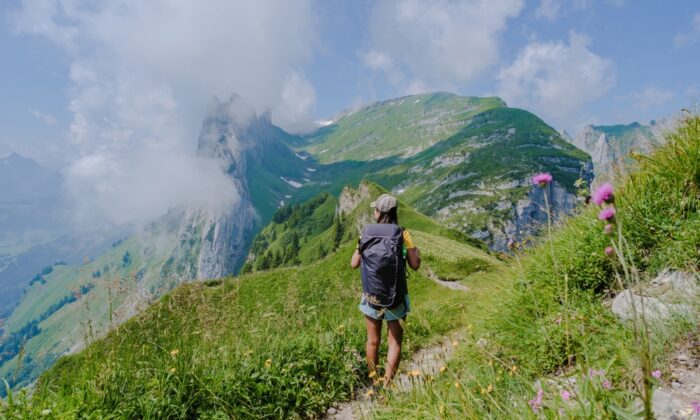 asian,women,hiking,in,the,swiss,alps,mountains,during,summer asian,women,hiking,in,the,swiss,alps,mountains,during,summer