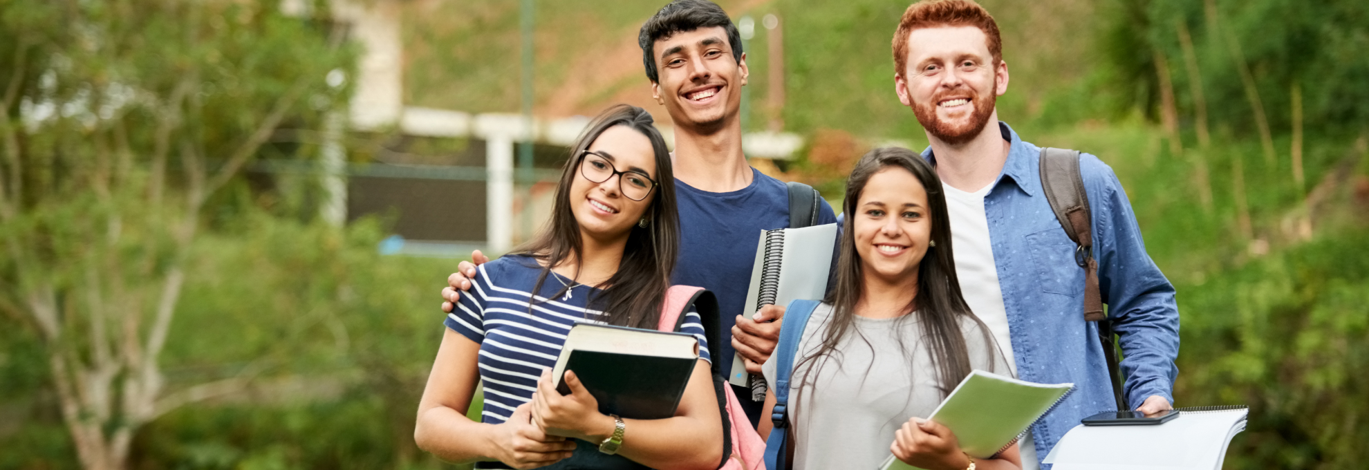 Real photo, a classroom or hallway in warm morning light — could be a teacher greeting a student at the door, or a quiet empty classroom just before the day starts