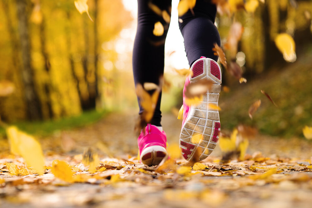 close,up,of,feet,of,a,runner,running,in,autumn close,up,of,feet,of,a,runner,running,in,autumn