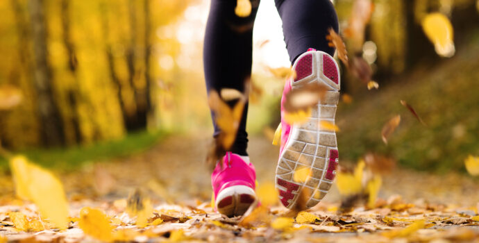 close,up,of,feet,of,a,runner,running,in,autumn