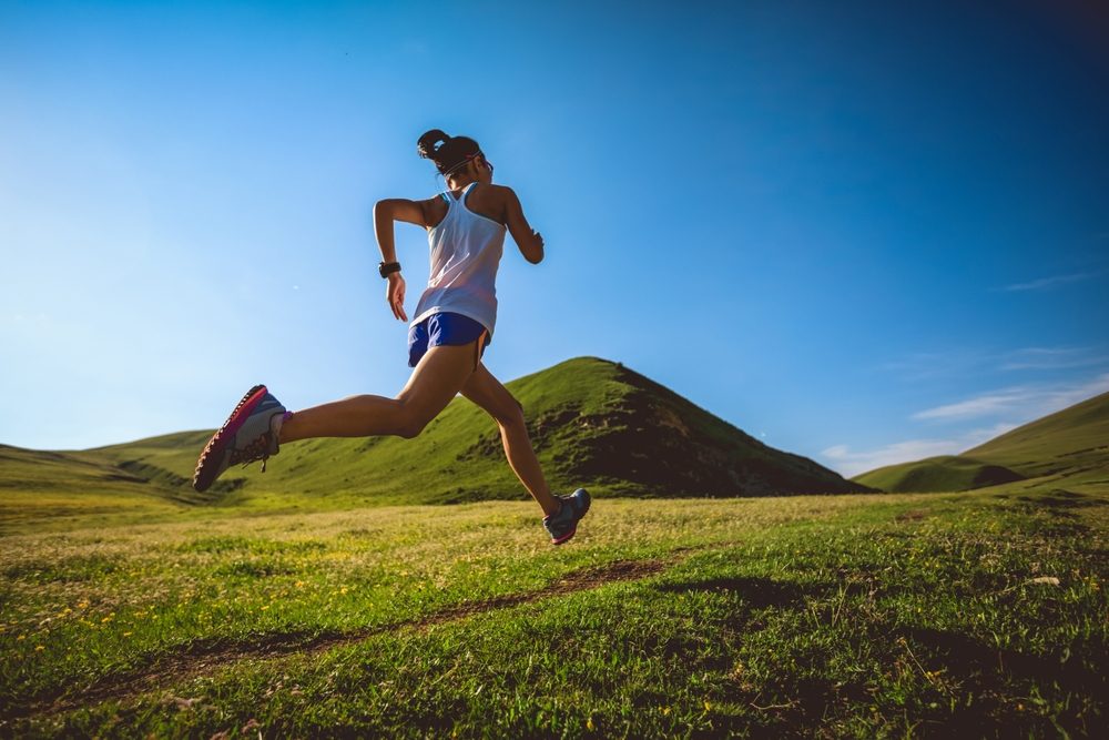 young,fitness,woman,trail,runner,running,on,high,altitude,grassland young,fitness,woman,trail,runner,running,on,high,altitude,grassland